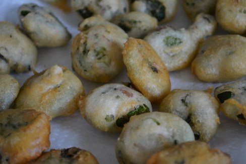 Tempura fried fiddleheads on kitchen towle paper