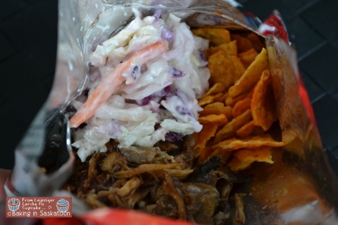 Pulled pork, coleslaw, and chips in a Doritos bag